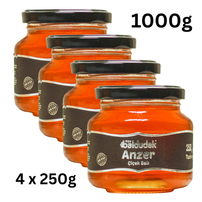 Vier Gläser Baldudak Anzer-Honig mit goldener Farbe – natürlich gesund & stärkend online bestellen für Immunsystem & Energie.